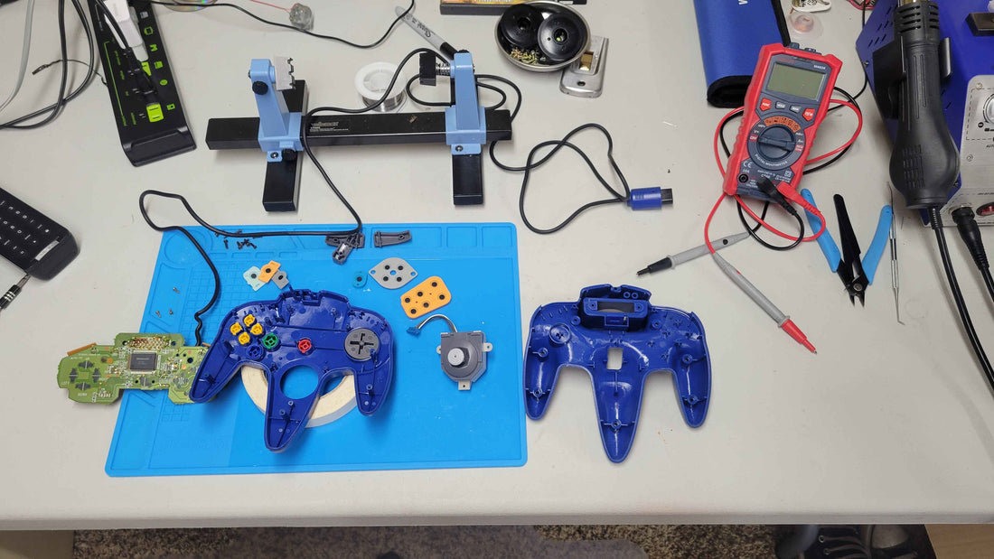 blue nintendo 64 controller open showing internal parts